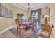 Formal dining room featuring a classic chandelier, detailed molding, and elegant furnishings at 9243 Marina Pkwy., Myrtle Beach, SC 29572