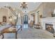Living room featuring a fireplace, chandelier, and comfortable seating area at 9243 Marina Pkwy., Myrtle Beach, SC 29572