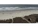 Aerial view showcases direct beach access via a wooden boardwalk at 102 N Ocean Blvd. # 903, North Myrtle Beach, SC 29582