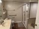 Well-lit bathroom featuring a glass-enclosed shower, modern fixtures and ceramic tile floors at 102 N Ocean Blvd. # 903, North Myrtle Beach, SC 29582