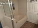 Well-lit bathroom with a glass enclosed shower and soaking tub at 102 N Ocean Blvd. # 903, North Myrtle Beach, SC 29582