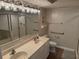 Bathroom features double sinks with modern fixtures and a glass enclosed shower at 102 N Ocean Blvd. # 903, North Myrtle Beach, SC 29582