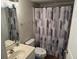 Standard bathroom featuring neutral wall colors, patterned shower curtain, toilet, and vanity at 102 N Ocean Blvd. # 903, North Myrtle Beach, SC 29582