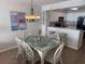 Dining area featuring a glass table, seating for eight, and easy access to kitchen with barstool seating at 102 N Ocean Blvd. # 903, North Myrtle Beach, SC 29582