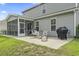 A backyard with patio space, outdoor furniture, a grill, and an expansive lawn at 1101 Bronwyn Circle, North Myrtle Beach, SC 29582