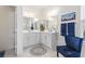 This bathroom features double sinks, a makeup vanity, and modern finishes for a luxurious experience at 1101 Bronwyn Circle, North Myrtle Beach, SC 29582