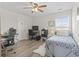 Bright bedroom features wood-look floors, ceiling fan, desk area, and a cozy twin bed at 1101 Bronwyn Circle, North Myrtle Beach, SC 29582