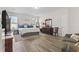 Bright bedroom boasts ample natural light, wood floors, an area rug, and a comfortable seating area at 1101 Bronwyn Circle, North Myrtle Beach, SC 29582