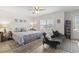 Bedroom with plenty of natural light, a comfortable futon, and wood-look floors at 1101 Bronwyn Circle, North Myrtle Beach, SC 29582