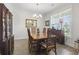 Charming dining room featuring a wooden table, comfortable chairs, and ample natural light at 1101 Bronwyn Circle, North Myrtle Beach, SC 29582