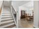 Elegant entryway featuring hardwood floors, a staircase, and a view into the dining room at 1101 Bronwyn Circle, North Myrtle Beach, SC 29582