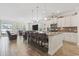 Spacious kitchen with a large island, bar stool seating, modern appliances, and an open concept living area at 1101 Bronwyn Circle, North Myrtle Beach, SC 29582