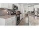 A kitchen featuring granite countertops, stainless steel appliances, and gray subway tile backsplash at 1101 Bronwyn Circle, North Myrtle Beach, SC 29582