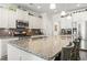 Modern kitchen featuring stainless steel appliances, an island with granite countertops, and ample cabinet space at 1101 Bronwyn Circle, North Myrtle Beach, SC 29582