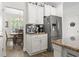 Kitchen featuring stainless steel refrigerator and coffee bar with granite countertops and dining area view at 1101 Bronwyn Circle, North Myrtle Beach, SC 29582