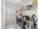 A practical laundry room with a window and modern washer and dryer appliances at 1101 Bronwyn Circle, North Myrtle Beach, SC 29582