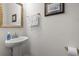 This powder room offers a pedestal sink, decorative mirror, and is conveniently located for guests at 1101 Bronwyn Circle, North Myrtle Beach, SC 29582