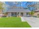 Charming single-story home featuring a well-manicured lawn and inviting curb appeal at 111 Hickory Dr., Conway, SC 29526