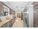 Bright kitchen with granite countertops, stainless steel appliances, and access to sunroom at 111 Hickory Dr., Conway, SC 29526