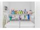 Functional laundry room with modern washer and dryer, shelving, and ample storage space at 111 Hickory Dr., Conway, SC 29526
