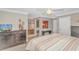 A primary bedroom is shown with an ensuite bathroom, grey paint, and wood-look floors at 111 Hickory Dr., Conway, SC 29526