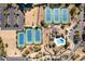 An aerial view showcases well-maintained tennis courts, swimming pool, and parking area in this community at 12 Spartina Ct. # 2, Pawleys Island, SC 29585