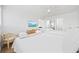 Bright bedroom features two beds, wood-look floors, and TV at 12 Spartina Ct. # 2, Pawleys Island, SC 29585