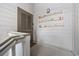 Hallway featuring coastal decor, including decorative oars hung on a white, wood-paneled wall at 12 Spartina Ct. # 2, Pawleys Island, SC 29585