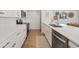 Modern kitchen features stainless steel appliances, white countertops, and cabinetry at 12 Spartina Ct. # 2, Pawleys Island, SC 29585