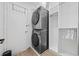 Functional laundry area features stackable washer and dryer and closet at 12 Spartina Ct. # 2, Pawleys Island, SC 29585