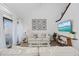 Bright living room showcasing modern decor, beach-themed artwork, and a cozy atmosphere at 12 Spartina Ct. # 2, Pawleys Island, SC 29585