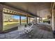 Outdoor patio with seating, offering serene views of lush greenery at 12 Spartina Ct. # 2, Pawleys Island, SC 29585