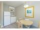Compact dining area, including a small kitchen with appliances, creates a cozy space at 1207 S Ocean Blvd. S # 507013, Myrtle Beach, SC 29577