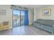 Bright living room with balcony access, showcasing stylish curtains and comfortable seating at 1207 S Ocean Blvd. S # 507013, Myrtle Beach, SC 29577