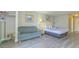 Living area featuring a bed, loveseat, and closet at 1207 S Ocean Blvd. S # 507013, Myrtle Beach, SC 29577