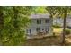 Charming home featuring a wooden deck perfect for outdoor dining and relaxing with lush landscaping at 1213 Oak St., Conway, SC 29526