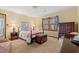 Cozy bedroom with a four-poster bed, wooden chest, and a floral valance at 1213 Oak St., Conway, SC 29526