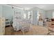 Bright bedroom features a iron bed, carpet floors, adjacent workspace, and natural light at 1213 Oak St., Conway, SC 29526