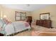 Comfortable bedroom featuring two chairs, traditional furniture, and a window view at 1213 Oak St., Conway, SC 29526