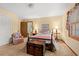 Inviting bedroom with a four-poster bed, cozy chair, and traditional decor at 1213 Oak St., Conway, SC 29526