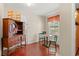 Cozy breakfast nook with brick flooring, vintage cabinet, and small table perfect for morning coffee at 1213 Oak St., Conway, SC 29526