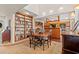 Open concept dining room to kitchen with built in bookshelves at 1213 Oak St., Conway, SC 29526