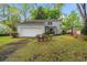 Charming home featuring a well-maintained lawn and colorful landscaping for great curb appeal at 1213 Oak St., Conway, SC 29526