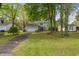Charming home with a well-maintained lawn, mature trees, and a two-car garage at 1213 Oak St., Conway, SC 29526