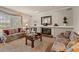 Living room features a decorative fireplace, neutral paint, and carpet at 1213 Oak St., Conway, SC 29526