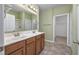 Well-lit bathroom with a double vanity, walk-in shower, and an open walk-in closet at 1501 Palmina Loop # B, Myrtle Beach, SC 29588