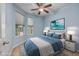 Comfortable bedroom with blue walls, carpet flooring, and bright window lighting at 1501 Palmina Loop # B, Myrtle Beach, SC 29588
