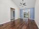 Bright living room with hardwood floors, vaulted ceiling, and sliding glass doors to the backyard at 1501 Palmina Loop # B, Myrtle Beach, SC 29588