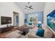 Staged living room boasting a neutral color palette and ample seating at 1501 Palmina Loop # B, Myrtle Beach, SC 29588