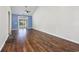 Spacious living room with hardwood floors, vaulted ceiling, and sliding glass doors to the backyard at 1501 Palmina Loop # B, Myrtle Beach, SC 29588